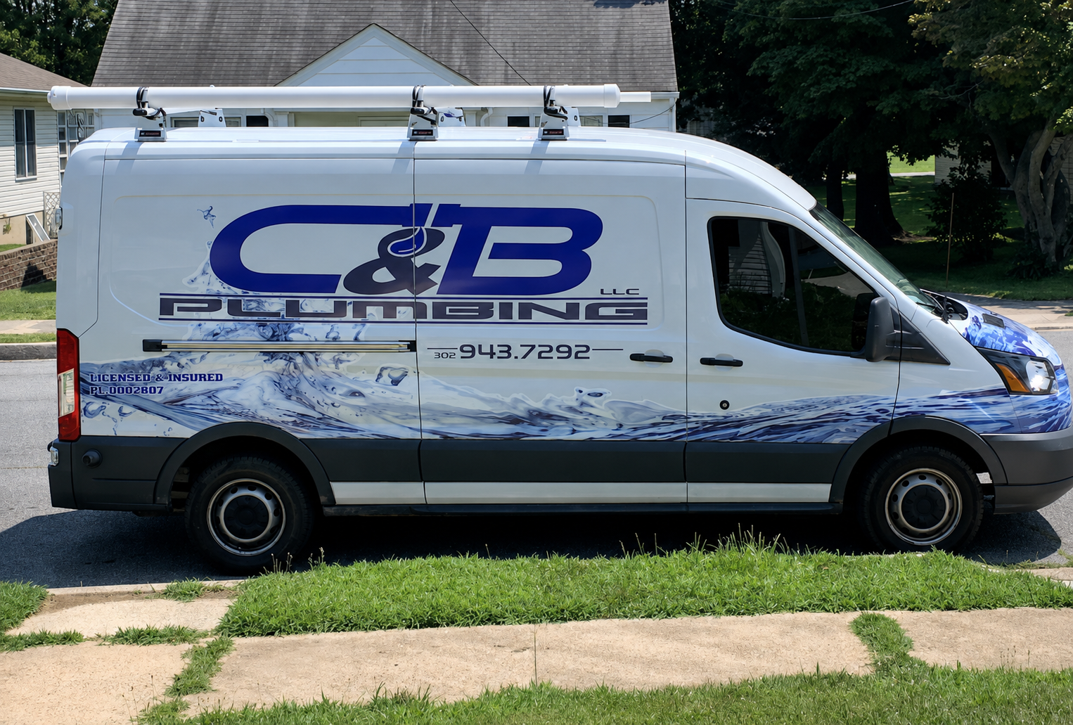 C & B Plumbing service van parked on a residential street in Frederica, Delaware